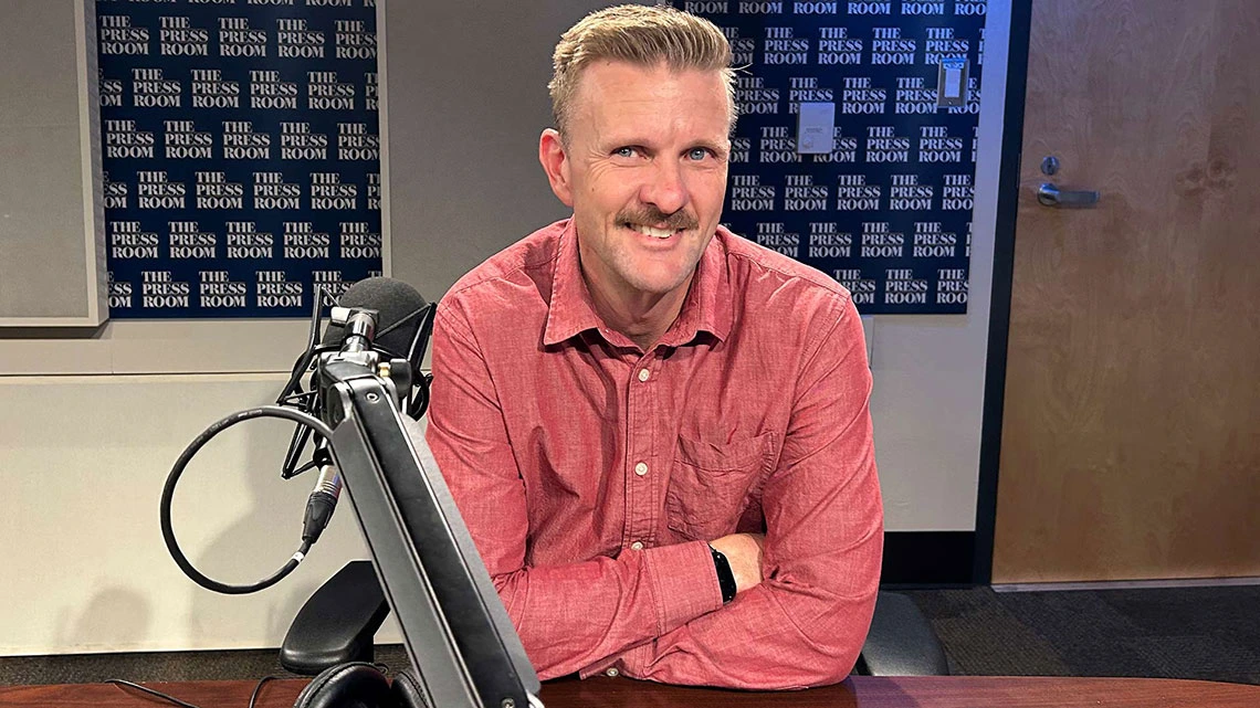Michael McKisson with microphone