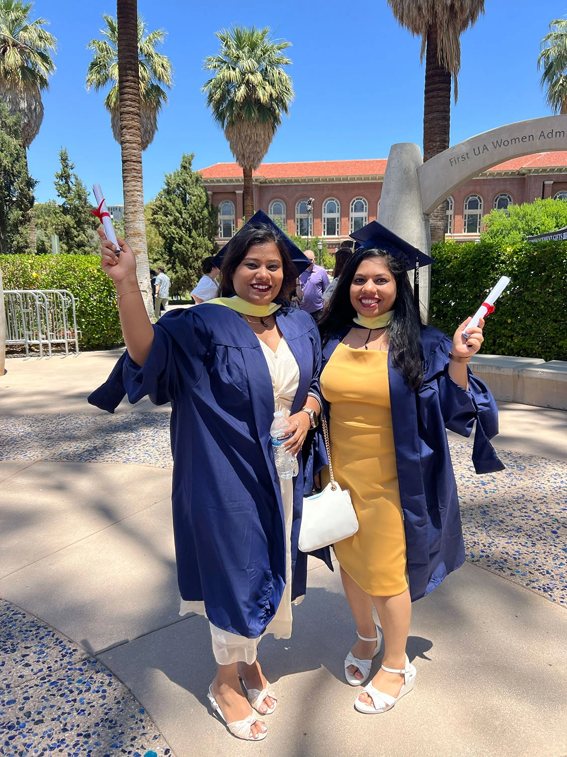 Graduates outside Centennial Hall