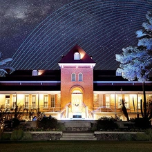 Old Main with digital patterns at night with Milky Way