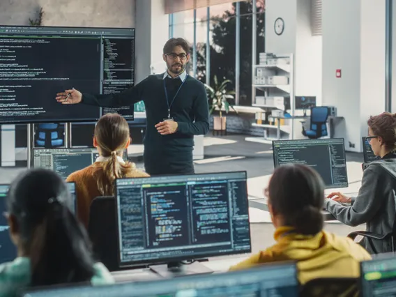 Computer classroom with teacher and students