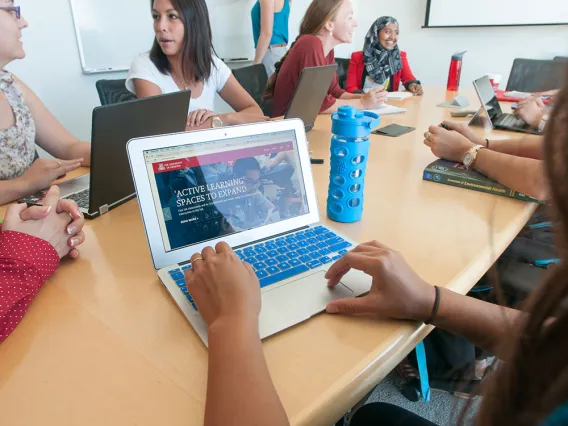 Laptop with students