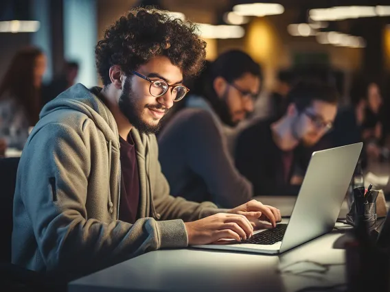 iSchool student at laptop