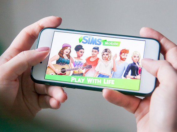 The Sims Mobile handheld game