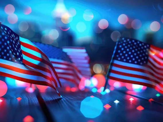 Abstract image of U.S. flags and stage lighting