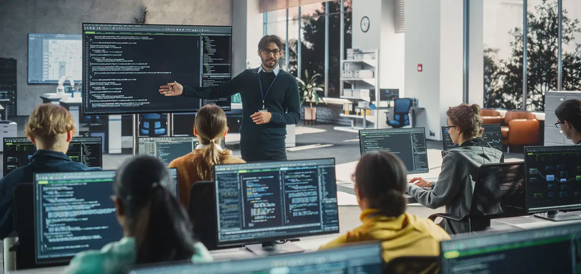 Computer classroom with teacher and students