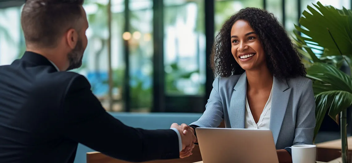 Employer and student shaking hands