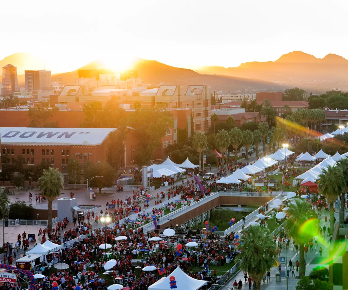 Homecoming tents on the UA Mall at sunset