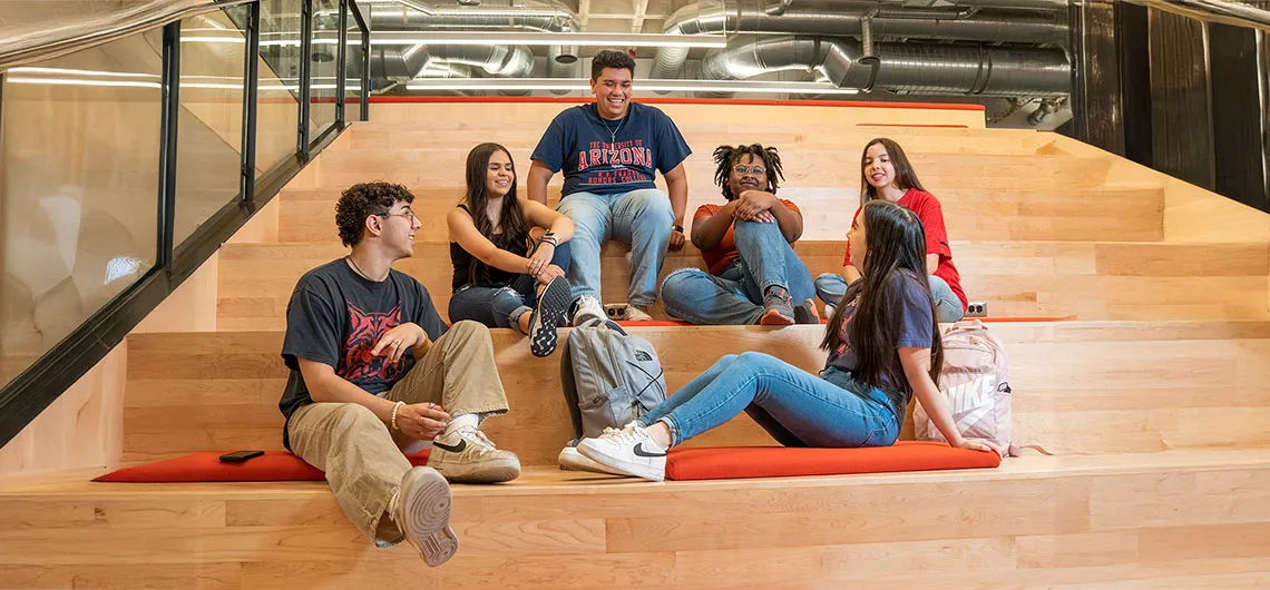 U of A students on library stairs