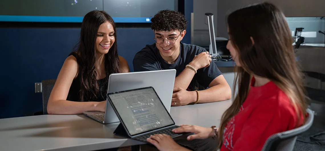 Students meeting with technology