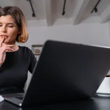 PhD student at laptop