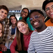 Diverse, smiling graduate students taking a selfie